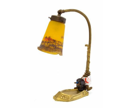 Muller Freres, Luneville, an At Nouveau table lamp with glass shade, gilt bass, the shade mottled orange brown over yellow, s