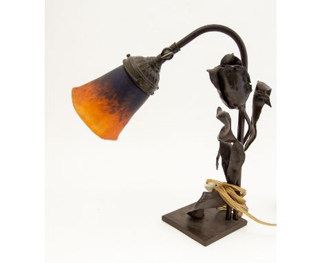 Charles Email Farion and Schneider, an Art Nouveau style bronzed and glass table lamp, the pate de verre shade on leaf and fl