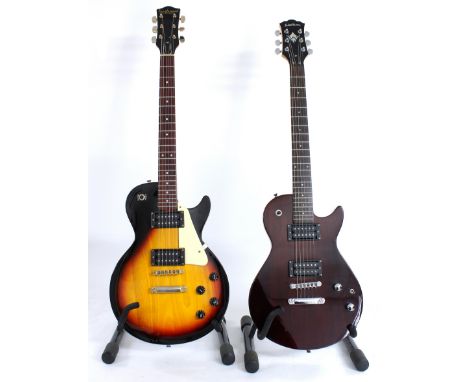 Two LP type electric guitars to include a Washburn and a Tanglewood, each with gig bag (2) 