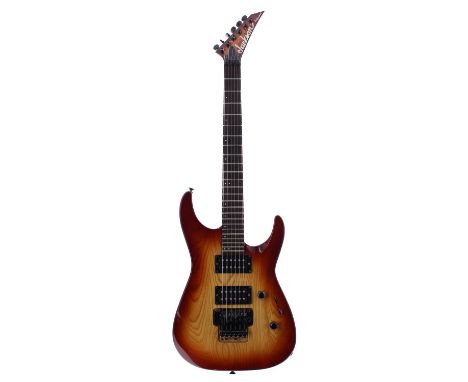1990s Jackson Professional electric guitar, made in Japan; Body: sunburst finish, heavy buckle patch wear to back, further mi