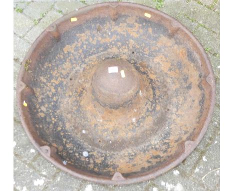 A cast iron circular livestock feeding trough, dia. 71cmFour holes drilled to base.Overall good condition.