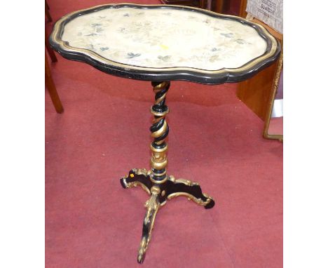 A Victorian ebonised gilt painted needlework floral silk inset shaped tilt-top pedestal tripod occasional table, width 63.5cm