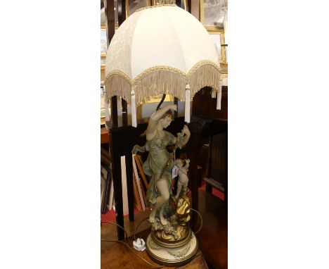 An Art Nouveau, painted and gilt decorated figural table lamp, after Moreau, with silk domed shade, height (excluding fitting