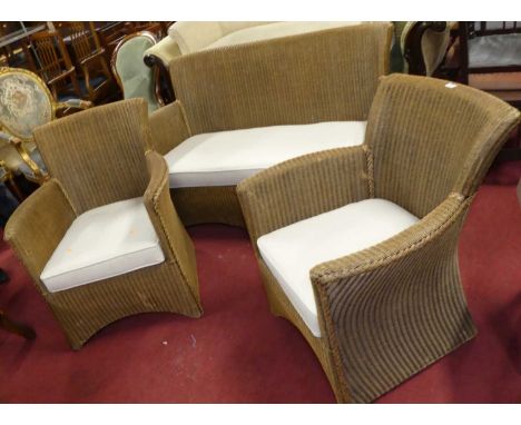 A contemporary Lloyd Loom Eastward Collection wicker three-piece conservatory suite, comprising; two-seater sofa and pair of 