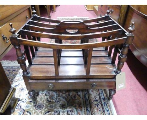 A circa 1830s mahogany four division Canterbury, having single long lower drawer on ring turned supports to castors, width 53