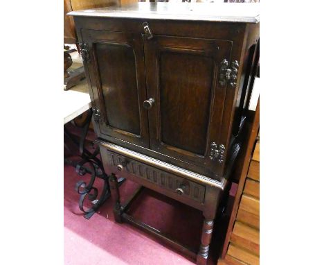 A contemporary 'Ipswich' joined oak small double door side cupboard, having single lower drawer, raised on ring turned and sq