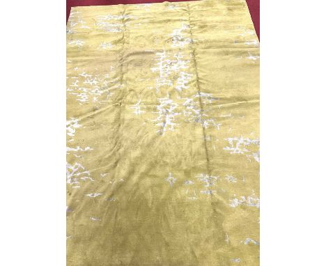 A contemporary lime green coloured woollen machine made carpet of good size