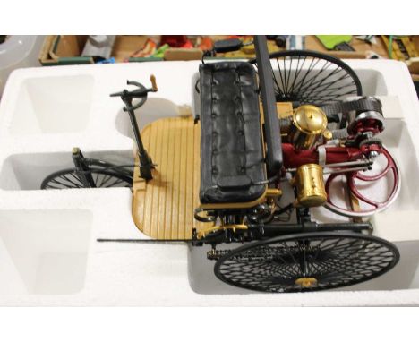 A Franklin Mint 1:8 scale boxed 1886 Benz patent Motorwagen bike, housed in a polystyrene box