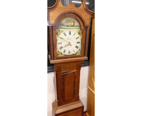 A circa 1800 North Country oak and mahogany cross banded long case clock, having an arch painted dial, signed John Davies, Br