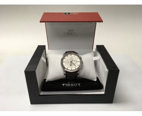 A boxed gentleman's Tissot 1853 automatic chronograph watch with a brown leather strap and white dial.