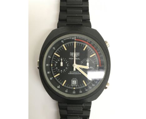 A rare gents Heuer Montreal Cal 12 automatic chronograph wristwatch. The black dial presents date aperture, two subsidiary di