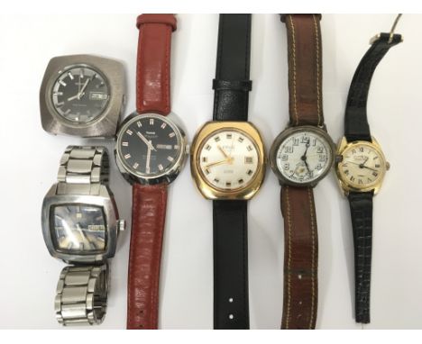 A collection of six wristwatches comprising a Benrus electronic watch with day-date aperture, a Tissot T-12 automatic wristwa