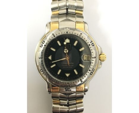 A Tag Heuer 6000 gents automatic chronometer wristwatch. The 18ct gold and stainless steel wristwatch, referenece WH5253-K1 n