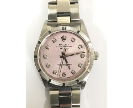 A Rolex Oyster Perpetual Air-King chronometer wristwatch. This ladies example has a pink floral dial presenting hourly diamon