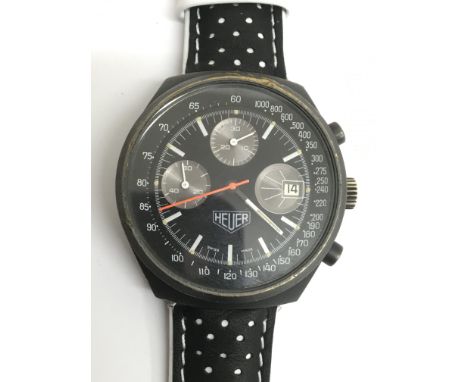 A gents Heuer manual wind chronograph wristwatch, the black dial presenting two brushed metal subsidiary dials and third cont