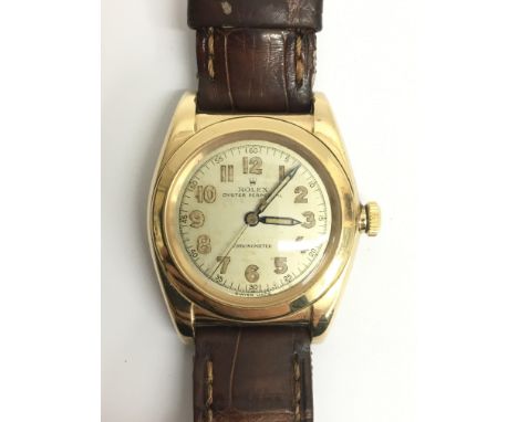 A gents Rolex automatic oyster perpetual chronometer wristwatch. The circa 1930s 14ct cased watch presents Arabic numerals an