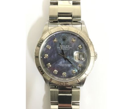 A Rolex oyster perpetual Date Just chronometer wristwatch. This ladies watch has an unusual mother of pearl dial with blue an