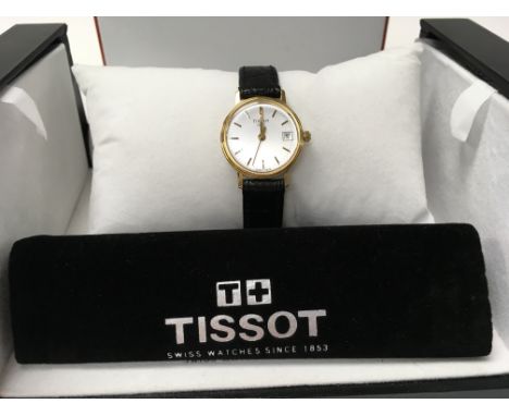 A boxed Tissot ladies 18ct 1853 watch with a brown leather strap.