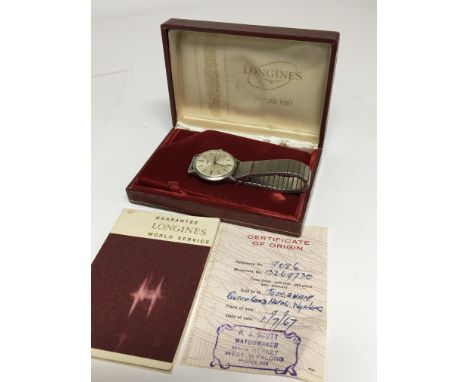 A Vintage Longines Flagship Crome Watch manual wind the dial with date apature. With orgional paperwork Ref 9086. movement nu