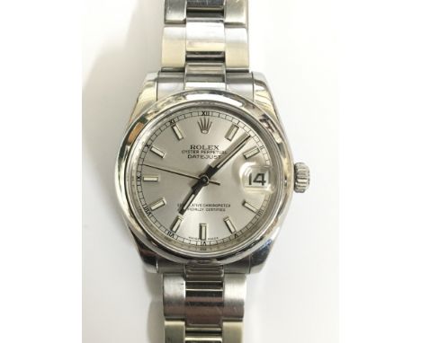 A Rolex Oyster Perpetual Datejust midi wristwatch. This certified chronometer has a brushed metal dial with raised baton nume
