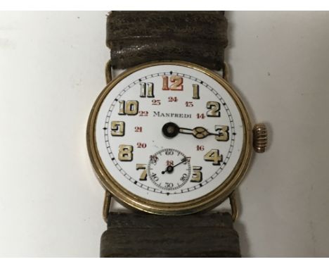 A Vintage Gold cased Manfredi Watch with an enamel dial. No glass bezel not seen working.  