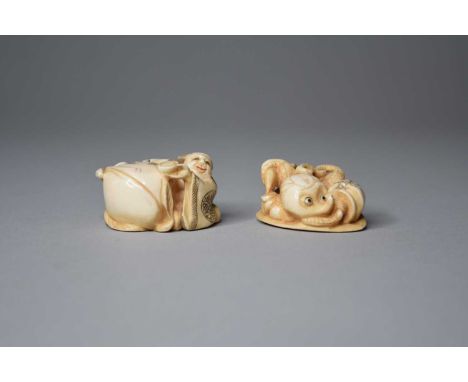 A Japanese ivory netsuki of Jurojin, Meiji periodModelled seated beside a gigantic peach, 4.5cm long, together with a netsuke