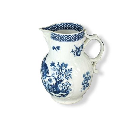 A Worcester cabbage leaf moulded mask-head jugcirca 1775transfer-printed in underglaze blue in the 'Parrot Pecking Fruit Patt