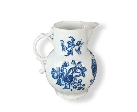A Worcester cabbage leaf mask-head jugcirca 1760-70transfer-printed in underglaze blue in the 'Natural Sprays' pattern, open 