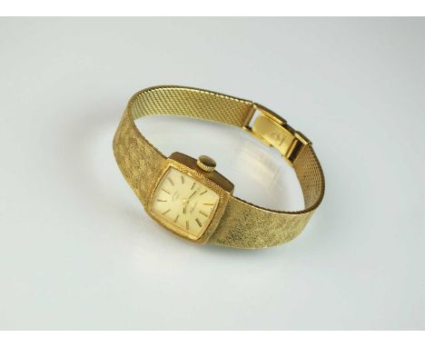 A lady's 9ct gold Rotary bracelet wristwatch, the square champagne coloured dial with batons, manual wind, 21 jewels, with at