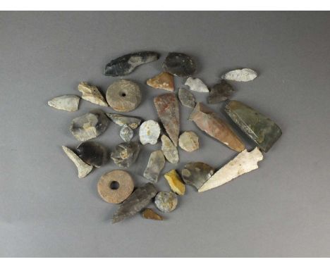 A collection of various Neolithic and later stone implements, arrow and axeheadscollected from New Zealand, North America and