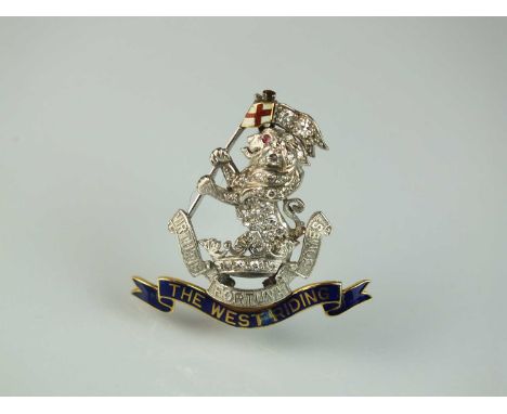A diamond and enamel regimental brooch, The Duke of Wellington Regiment The West Ridings, the diamond set lion with ruby eye 