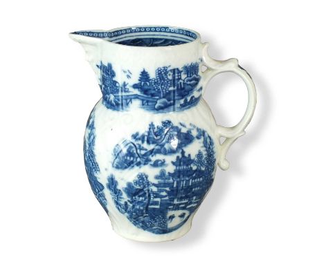 A Caughley mask-head cabbage leaf jug  circa 1782-93 transfer-printed in underglaze blue with the Conversation pattern and an