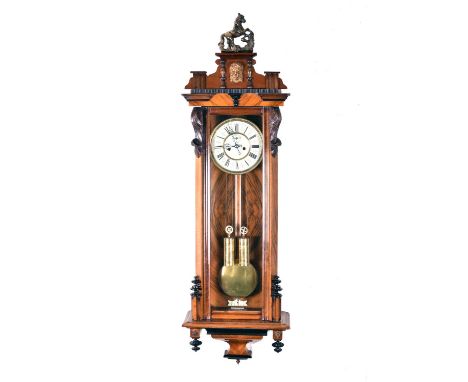 A large walnut and mahogany Vienna type wall clock, 19th/20th centuryAttributed to Gustav Becker, the typical rectangular cas