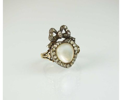 A 19th century moonstone and rose cut diamond heart and bow ring, designed as a central cabochon moonstone set within rose cu