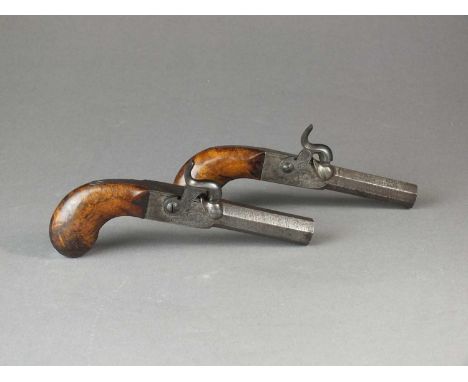 A pair of percussion pocket pistols19th centurywith 6cm rifled Damascus barrels, concealed triggers, foliate engraved frames 