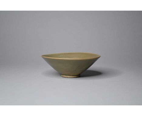 A Chinese Longquan celadon conical bowl, possibly Song DynastyOf conical form with short foot ring, covered in an olive green