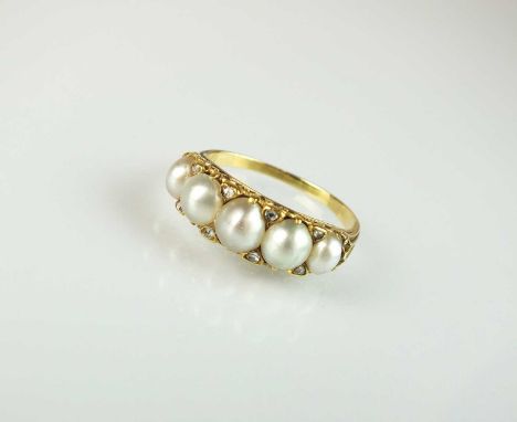A late 19th century split pearl and diamond ring, designed as five graduated half pearls claw set in yellow metal and intersp