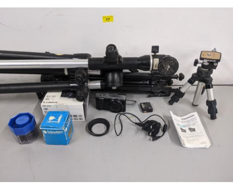 Assorted photographic equipment to include a tripod, a miniature tripod, and a Panasonic Lumix DMC-TZ80 in the original box.L