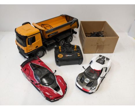 A collection of model vehicles to include a remote control 'Top Race' TR212 tipper truck, a Masto 1/18 scale RO17 Ford GT and