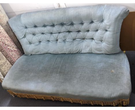 A Victorian blue button back upholstered two-seater sofa on turned legs and castors Location: LAMIf there is no condition rep