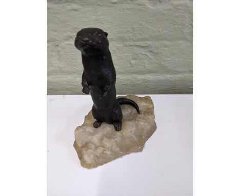 A bronze sculpture of an otter on an onyx style plinth Location: 7.1If there is no condition report shown, please request