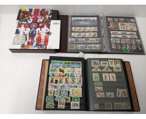 Two stamp albums, one containing a collection of Royal Mail First day covers, the other mixed stamps from around the world Lo