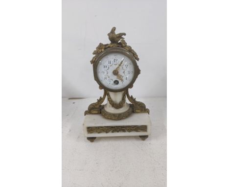 A late 19th century French marble and gilt metal mantel clock having a floral enamel dial and gilt handsLocation: 9.1If there