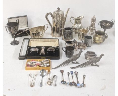 A selection of silver plated items to include a Mappin & Webb coffee pot having floral engraved decoration, sugar bowls, milk