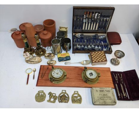 A mixed lot to include a boxed canteen of silver plated cutlery, Devon related horse brasses, three tankards, a collection of