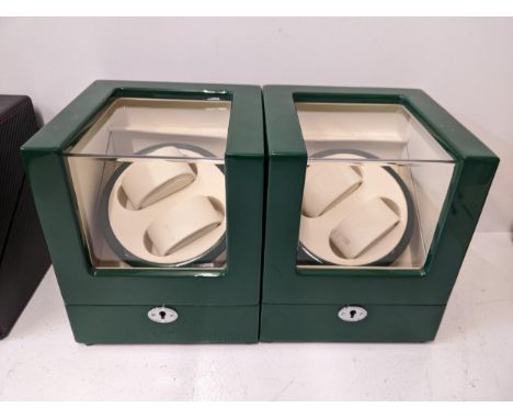 Two watch display cases with a green lacquered finish with rotate and lighting options, without cableLocation:1.5If there is 