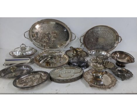 A selection of silver plated and other tableware to include oval entrée dishes, a pedestal dish, twin handled trays, a candel