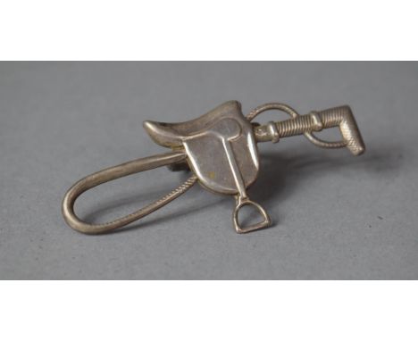 A Sterling Silver Scarf or Cravat Ring Decorated with Riding Crop and Saddle Stamped Sterling by Lana 