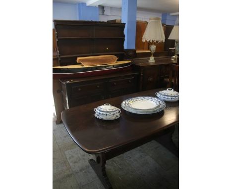 An Ercol refectory table and dresser.