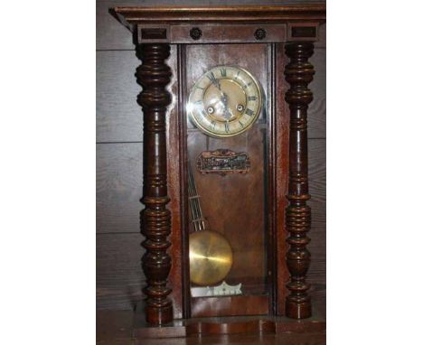EARLY 20TH CENTURY MAHOGANY REGULATOR WALL CLOCK with Roman numeral enamel dial and chapter ring and five rod pendulum, plaqu